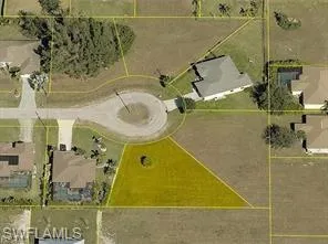 Aerial view of property and surrounding area with property boundaries highlighted