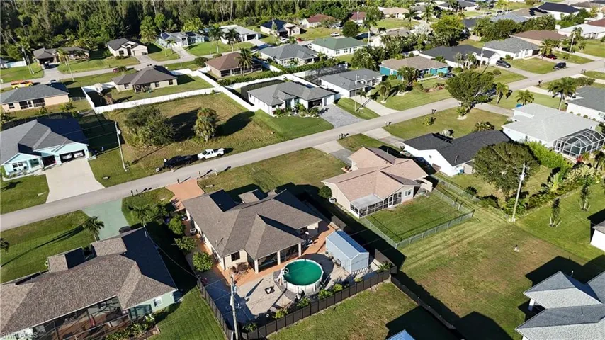 Aerial view of property's location featuring nearby suburban area