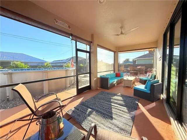 Sunroom / solarium with outdoor lounge area, ceiling fan, and healthy amount of natural light