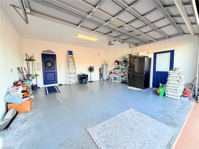 Garage with high end fridge and water heater