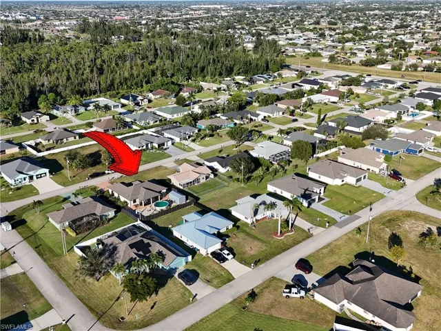 View of property location with nearby suburban area