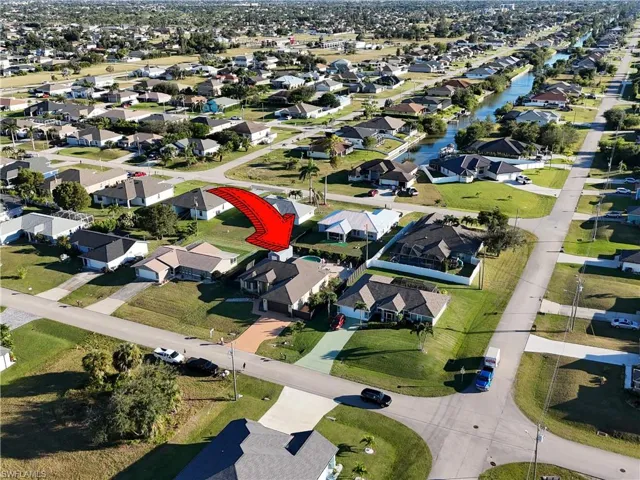 Aerial overview of property's location with nearby suburban area