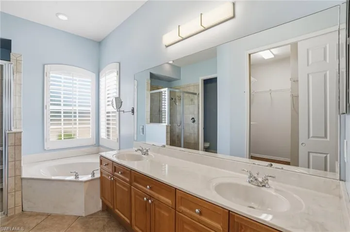 Dual vanity with tub and shower