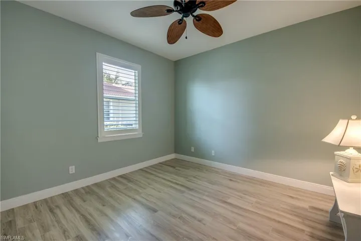 Unfurnished room with light wood-style flooring and ceiling fan
