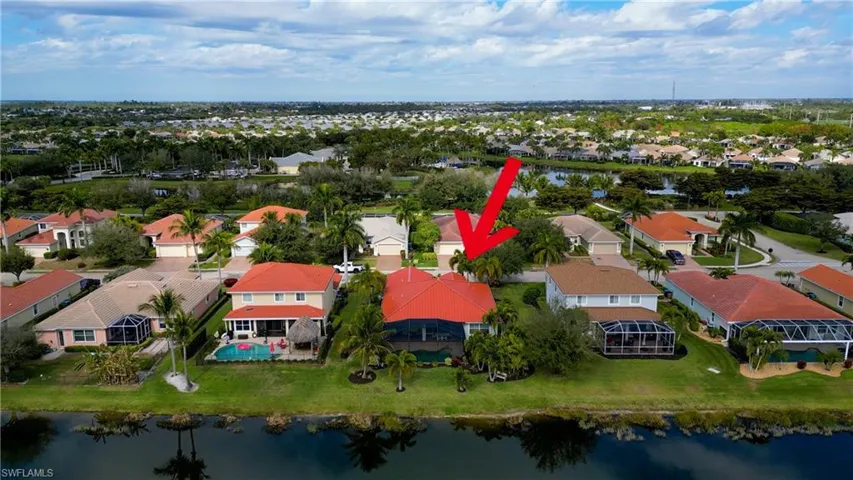 View of property location with a large body of water and nearby suburban area