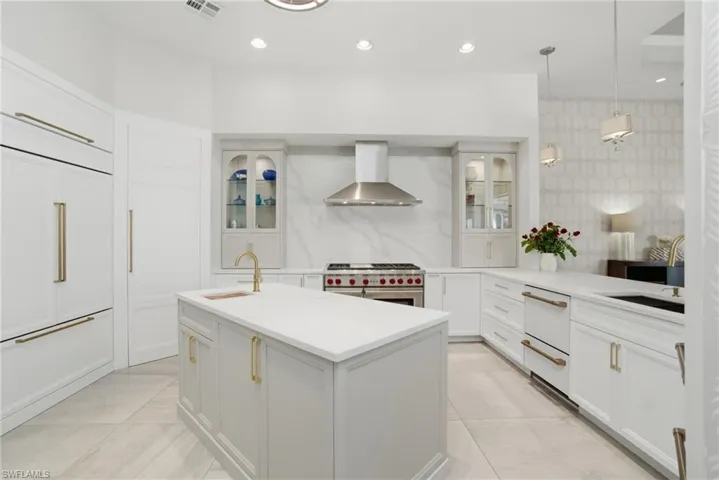 Beautifully renovated, coastal contemporary, waterfront estate in a private gated enclave with NATURAL GAS, boating Gulf-access & a 5-minute drive to the beach!