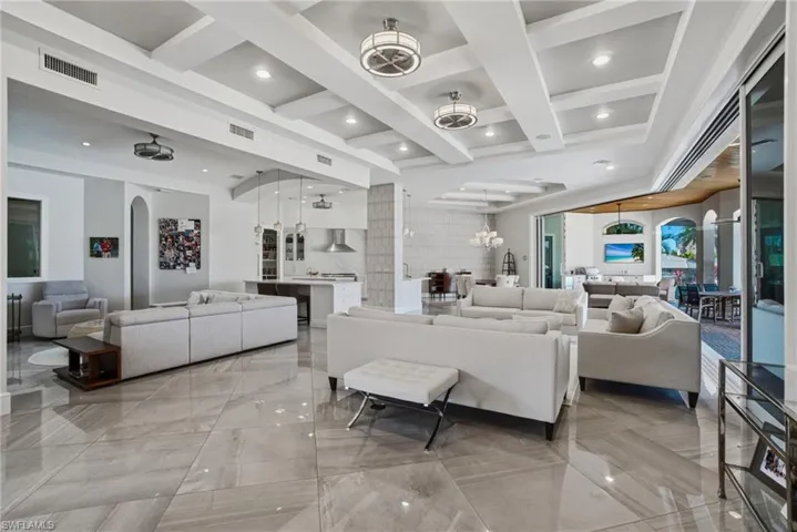 Features an INCREDIBLE open floor plan with 12 ft ceilings on the main level, 5 bedrooms, 5 full & 2 half baths with the primary suite + all main living spaces on the first floor.