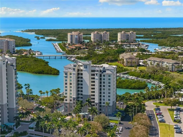 Aerial view of apartment complex and a nearby body of water