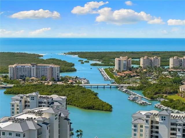 Aerial view of a nearby body of water and numerous boat docks