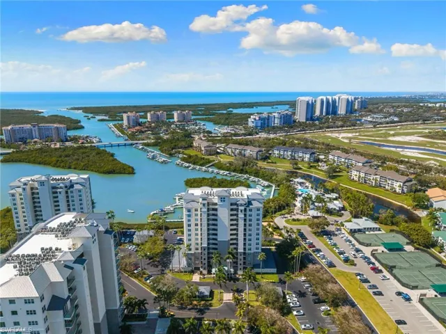 View of urban area featuring a large body of water and apartment complex / building