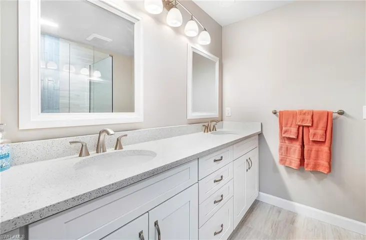 Bathroom featuring tile flooring and vanity