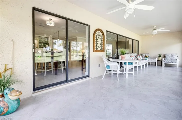 Sunroom featuring ceiling fan
