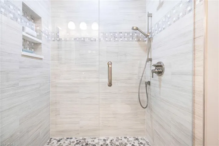 Bathroom with a shower with door
