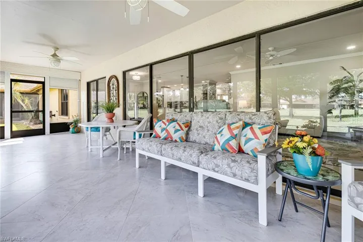 Sunroom featuring ceiling fan
