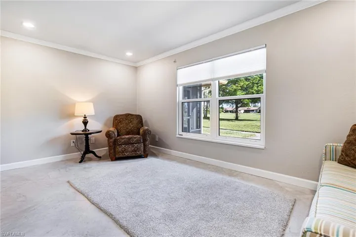 Living area featuring ornamental molding