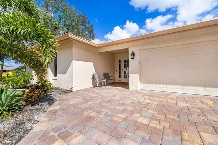 Entrance to property featuring a garage