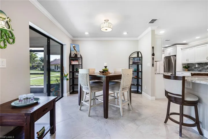 Dining room with ornamental molding