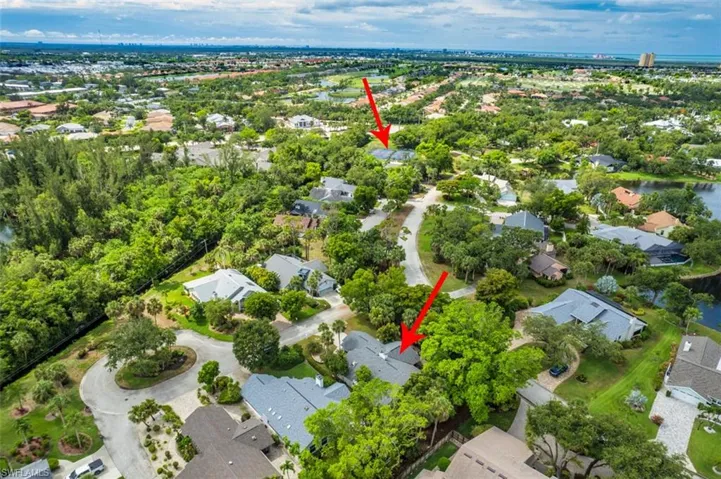 Aerial view of property's location with nearby suburban area