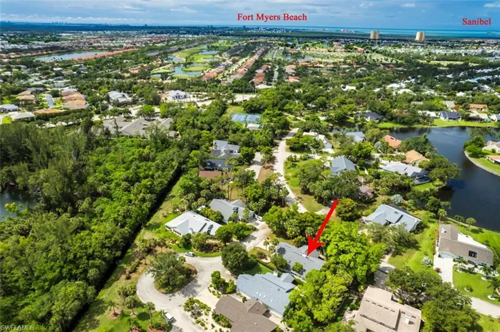 Aerial perspective of suburban area with a large body of water