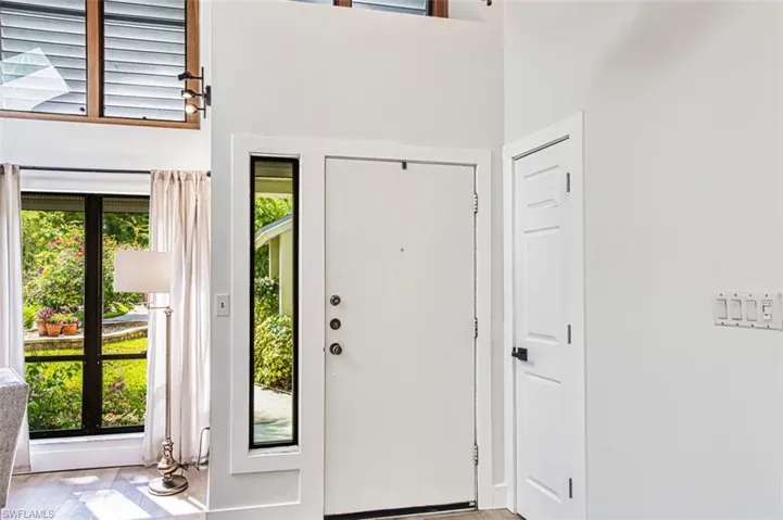 Entrance foyer with light wood finished floors