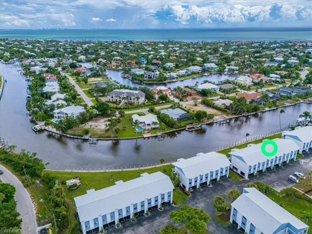 Aerial perspective of suburban area with a large body of water