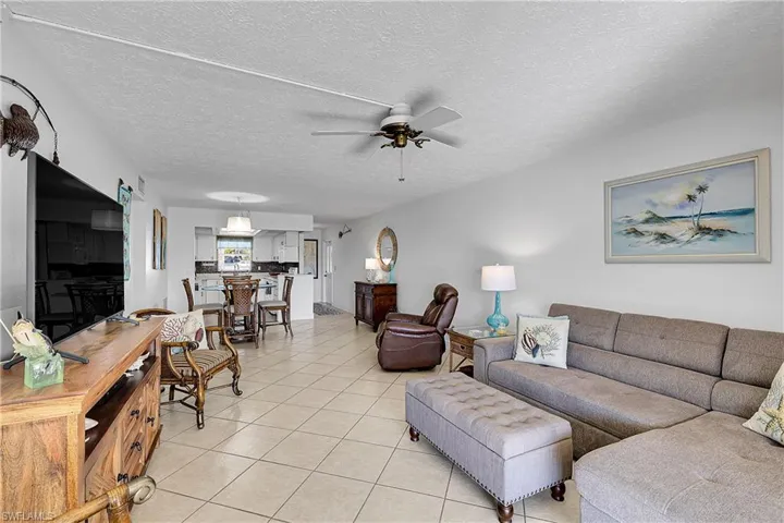 View from lanai sliders reveals open layout, all the way to the foyer. NO CARPET! Condo is selling TURNKEY!