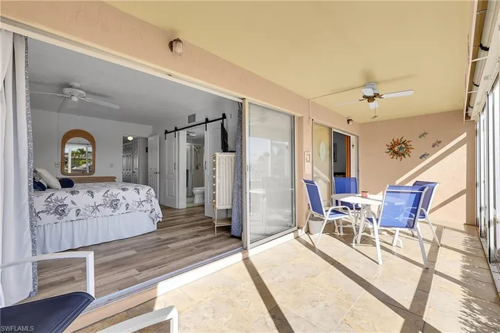 Bring the outdoors in with 2 sets of disappearing sliders. Primary bedroom has direct access to lanai. Laminate wood flooring is waterproof. NO CARPET!