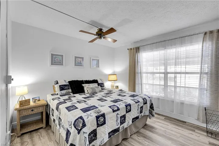 Second (guest) bedroom measures a spacious 14'x11' and has big windows. Laminate wood flooring is in both bedrooms.