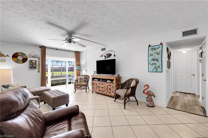 Spacious living room measures 16'x13' and has access to the lanai and the boat dock. Interior storage room at end of hall (door on right) measures a whopping 8'x5'.