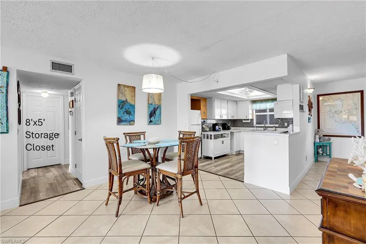 Dining area is convenient to the kitchen. Huge interior storage room is behind the closed door on the left.