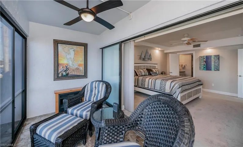 Bedroom with ceiling fan, a closet, and carpet floors
