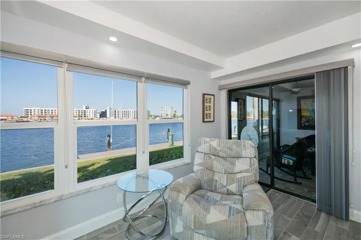 Sunroom / solarium with a water view