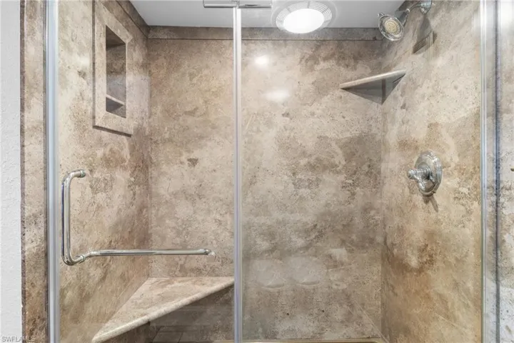 Bathroom featuring walk in shower