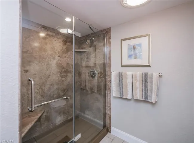 Bathroom with a shower with shower door