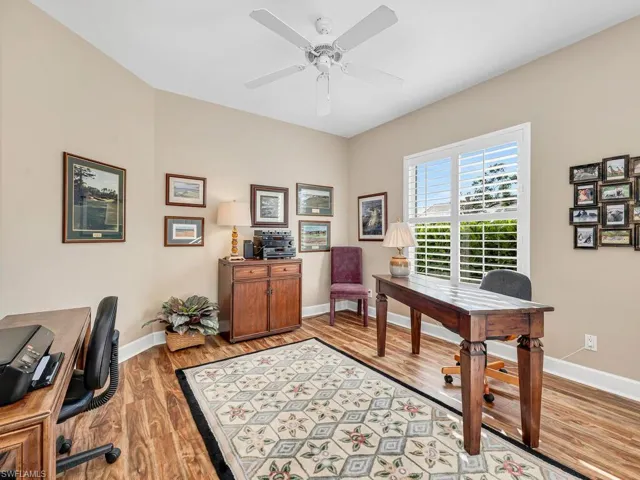 Home office featuring ceiling fan and light wood-type flooring
