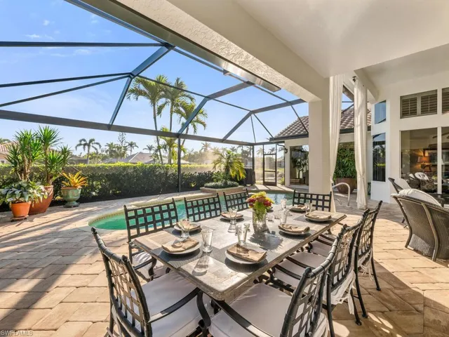 View of patio / terrace featuring a lanai