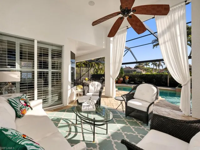 View of patio featuring a lanai, an outdoor hangout area, and ceiling fan