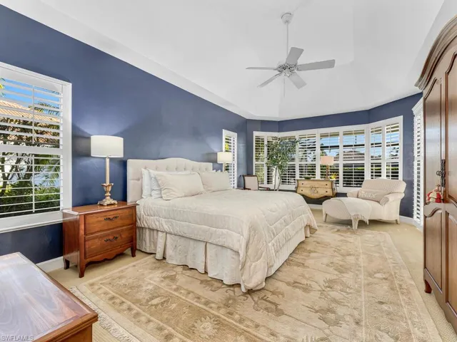 Bedroom featuring ceiling fan and carpet flooring