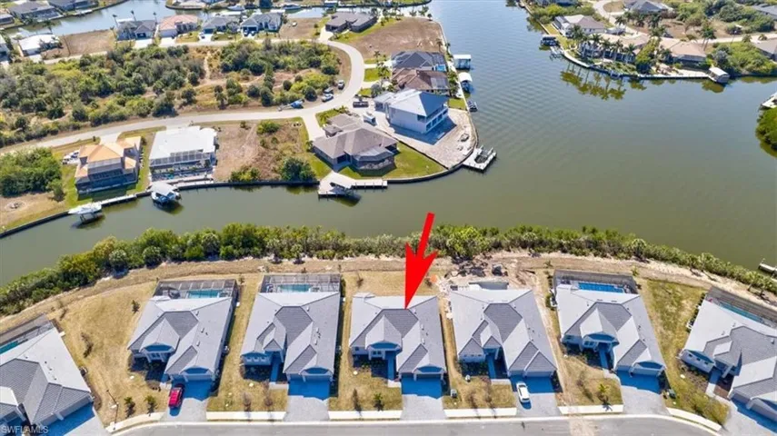 Aerial view of residential area with a large body of water