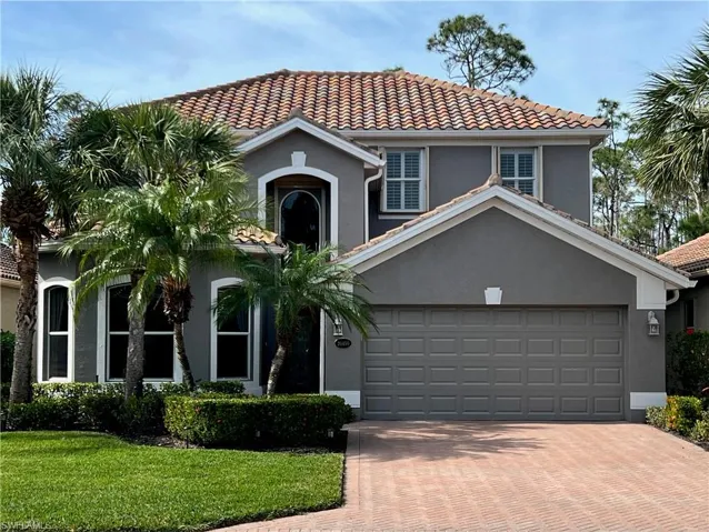 Traditional house featuring lovely yard and two car garage
