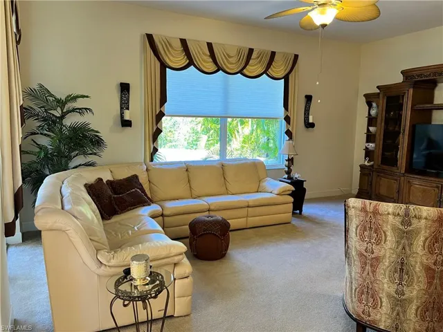 Spacious family room with large window and sliding door