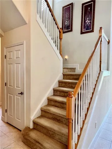 Stairway to second floor with storage under stairs