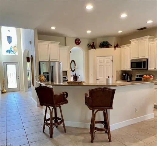 Kitchen featuring breakfast bar