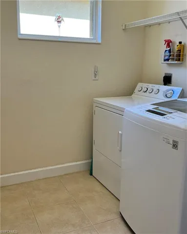 Laundry room featuring new washer and dryer