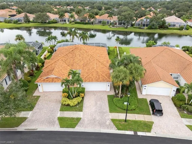 Aerial perspective of suburban area with a large body of water