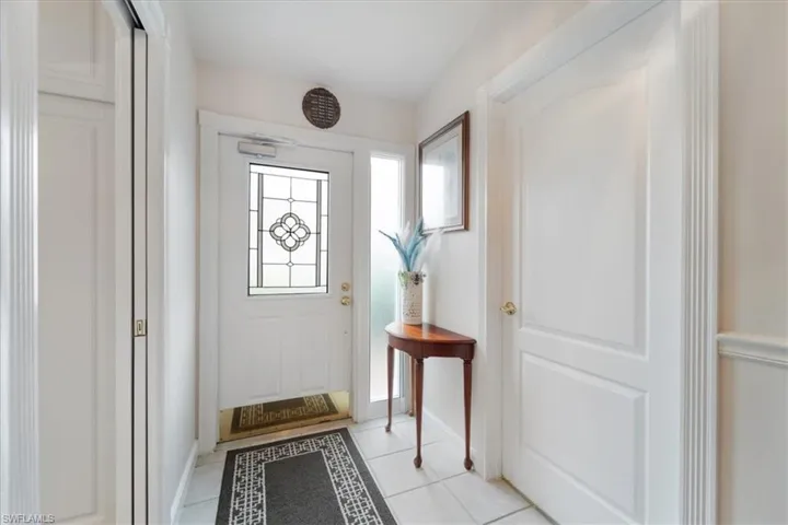 Doorway with tile patterned flooring