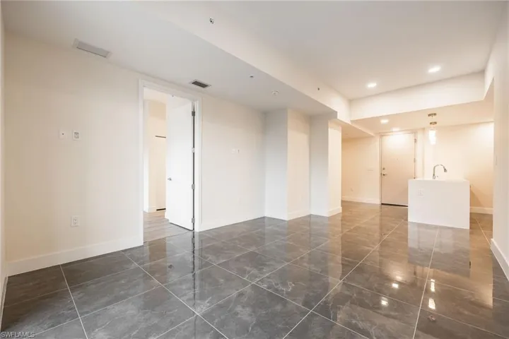 Spare room featuring recessed lighting, baseboards, and visible vents