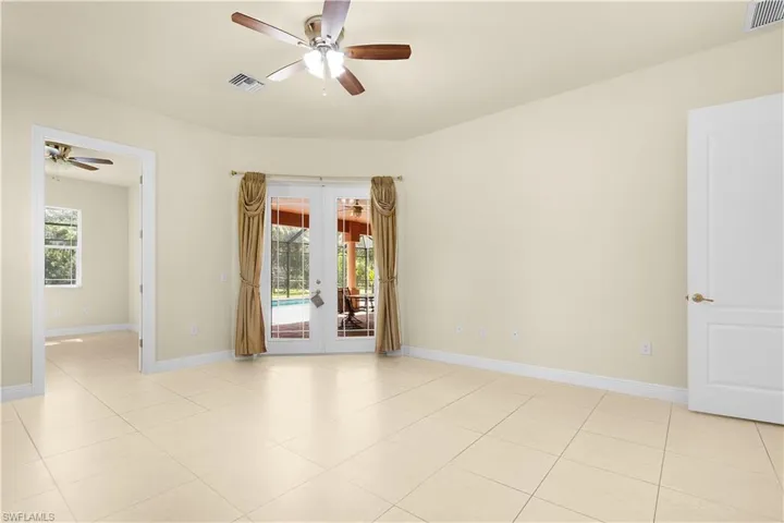 Primary suite showing access to dual walk in closets and primary suite bathroom.