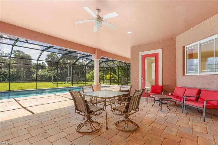 Year round entertaining under truss accessible from kitchen, primary bedroom, flex room and living room.