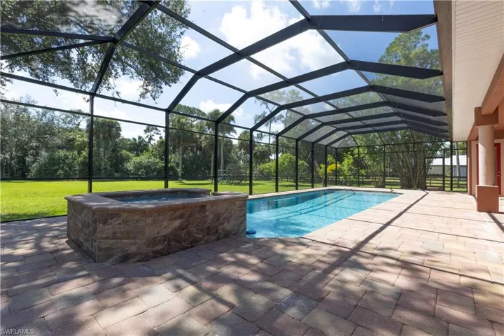 This home offers 2811 sq ft with 4 bedrooms, plus office space, 2.5 bathrooms, large rear screened in lanai complete with pool and spa. Plenty of privacy on the 2.5 acres of fenced property!